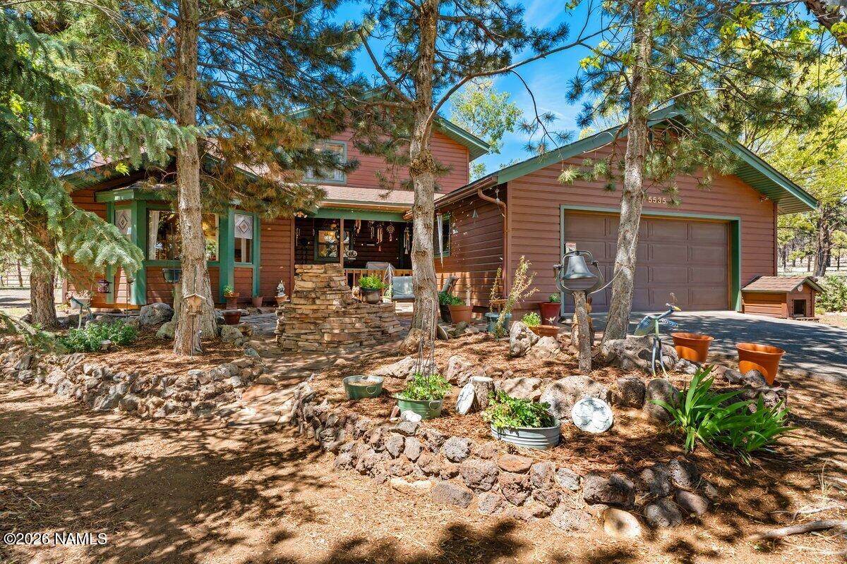 a backyard of the house with outdoor seating