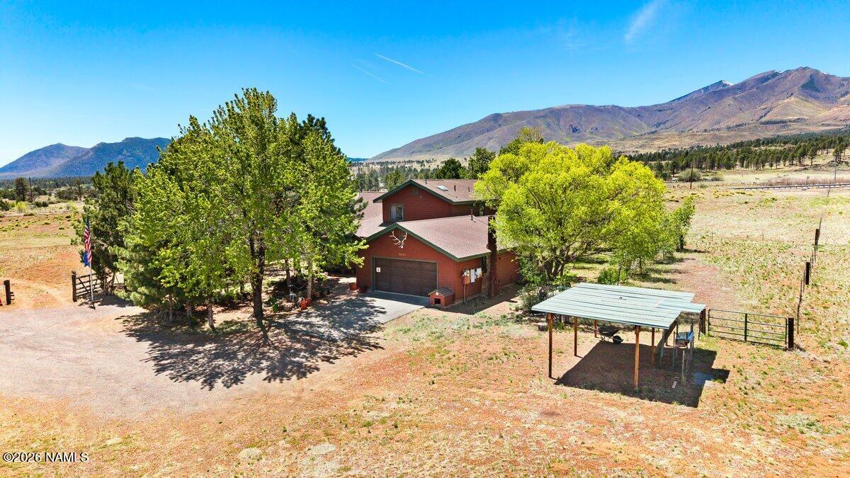 5535 East Western Star Road Flagstaff, AZ 86004 - Photo 2 of 44 a view of a terrace with furniture and a garden