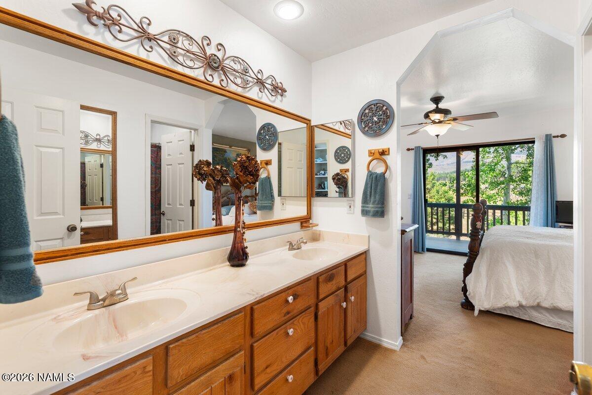 5535 East Western Star Road Flagstaff, AZ 86004 - Photo 23 of 44 a spacious en suite bathroom with a double vanity sink and a mirror