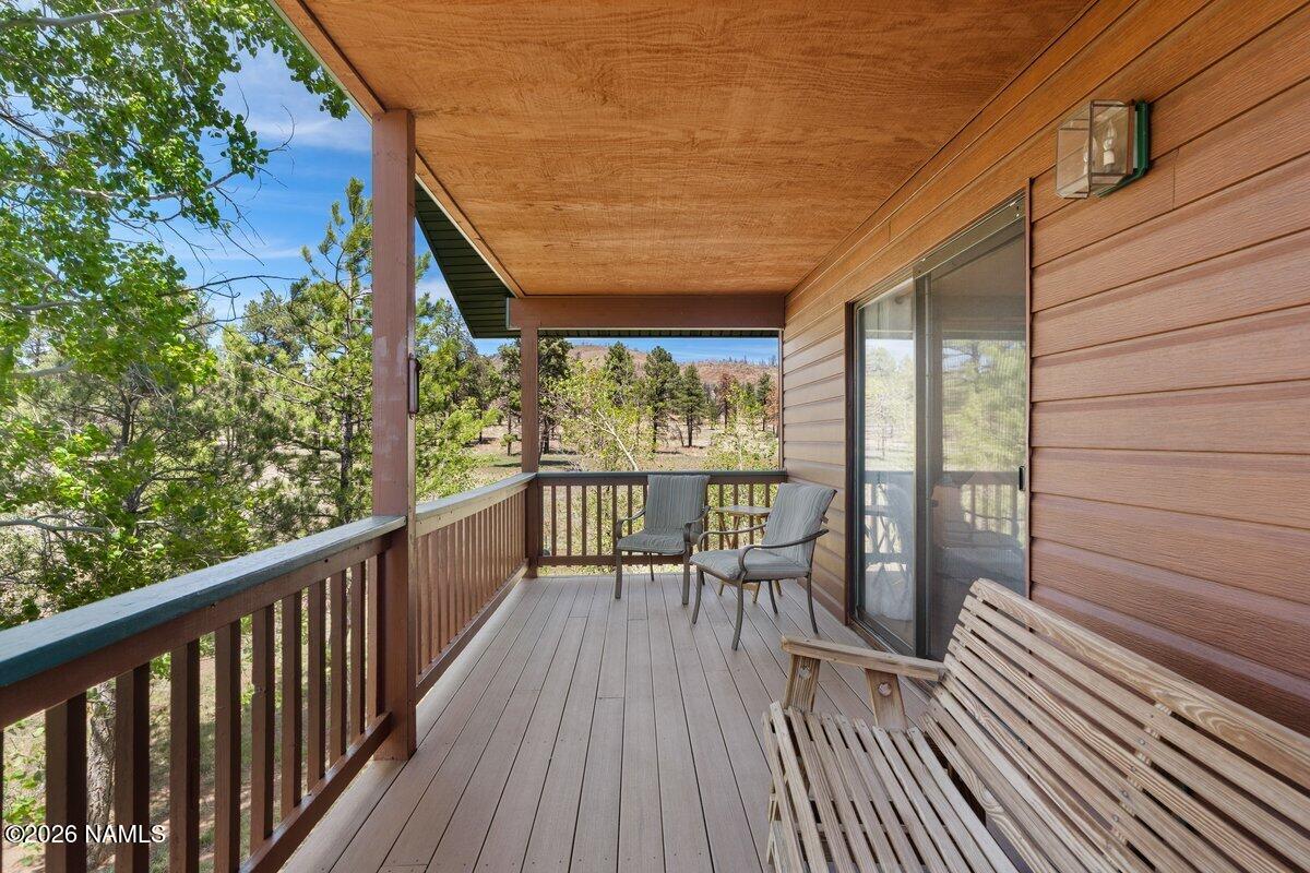 5535 East Western Star Road Flagstaff, AZ 86004 - Photo 27 of 44 a view of a two chairs with wooden floor in front of house