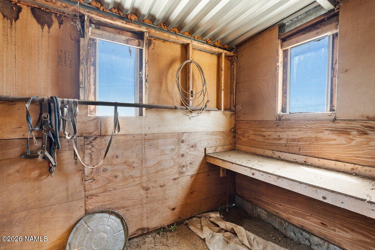 5535 East Western Star Road Flagstaff, AZ 86004 - Photo 35 of 44 a bathroom with a granite countertop sink and a mirror