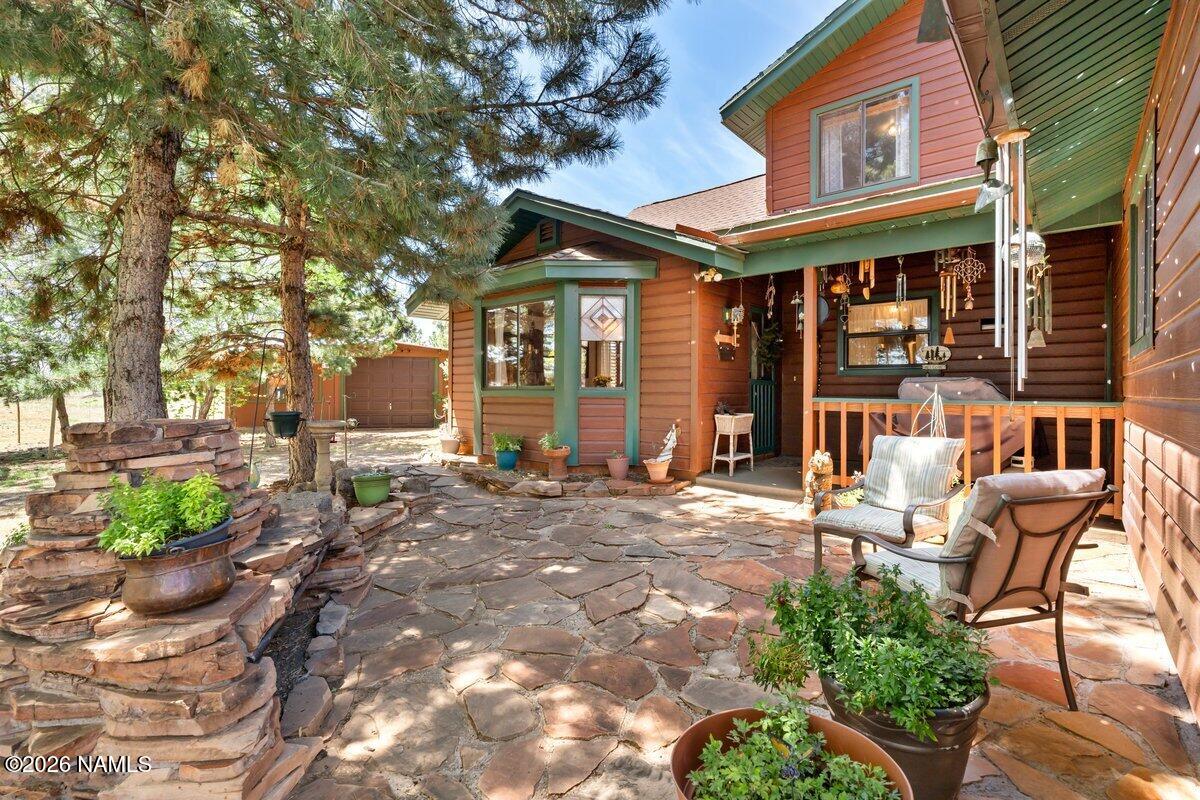 5535 East Western Star Road Flagstaff, AZ 86004 - Photo 36 of 44 a view of a house with backyard and sitting area