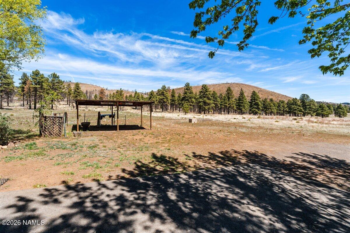 5535 East Western Star Road Flagstaff, AZ 86004 - Photo 38 of 44 a view of a lake with a mountain
