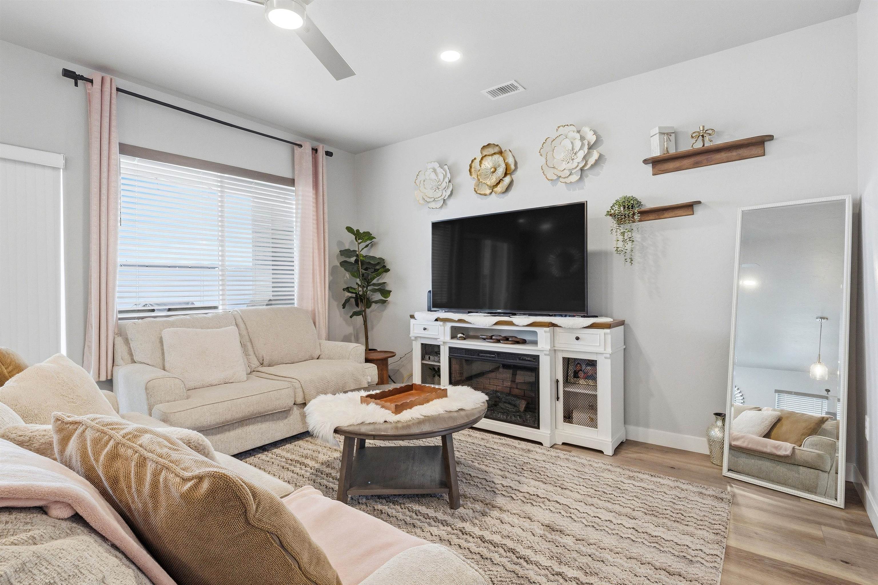 2459 Hamilton Road, Unit A Grand Junction, CO 81505 - Photo 5 of 27 a living room with furniture and a flat screen tv