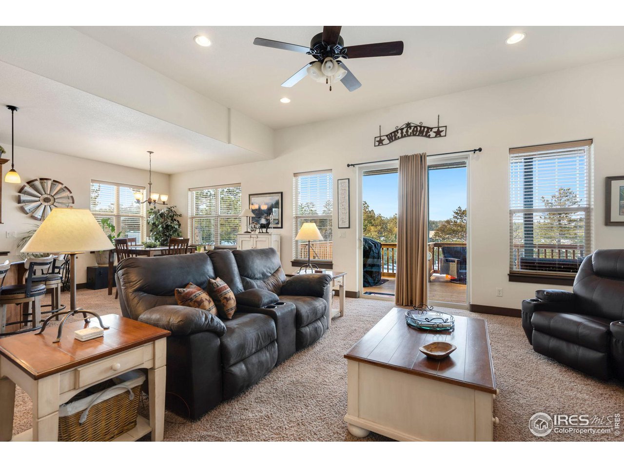 200 Cherokee Meadows Road Livermore, CO 80536 - Photo 12 of 40 Living Room leading to your covered deck with more views