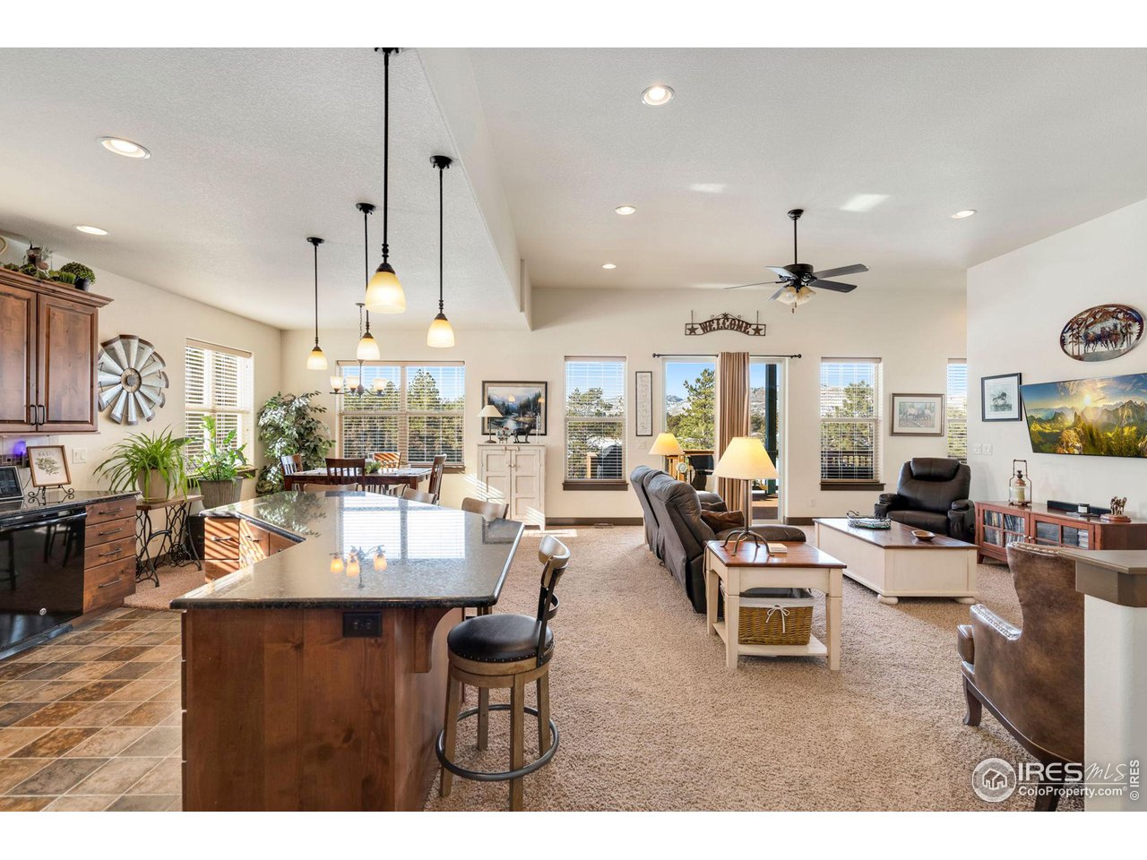 Open with high ceiling and lots of Pella windows with the views and natural light