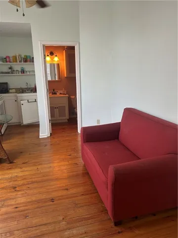 a bedroom with a bed and a mirror