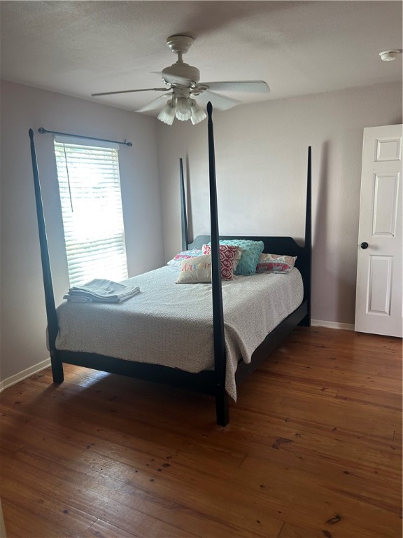 902 Eleventh Street Port Aransas, TX 78373 - Photo 15 of 16 a bedroom with a bed and a mirror