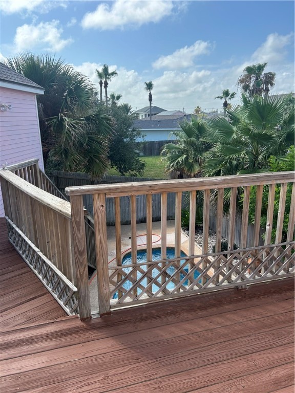 902 Eleventh Street Port Aransas, TX 78373 - Photo 5 of 16 a view of a house with wooden deck