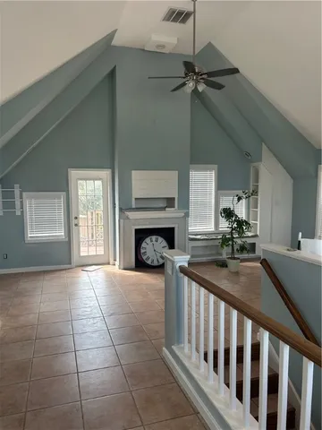 a view of an empty room and fire place