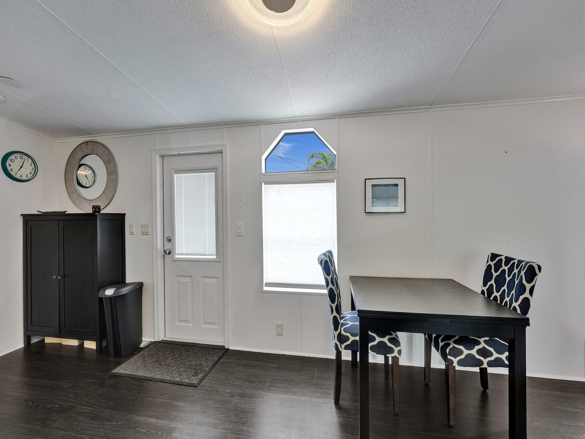 14609 Sunset Drive Delray Beach, FL 33445 - Photo 16 of 50 a view of a livingroom with furniture and wooden floor