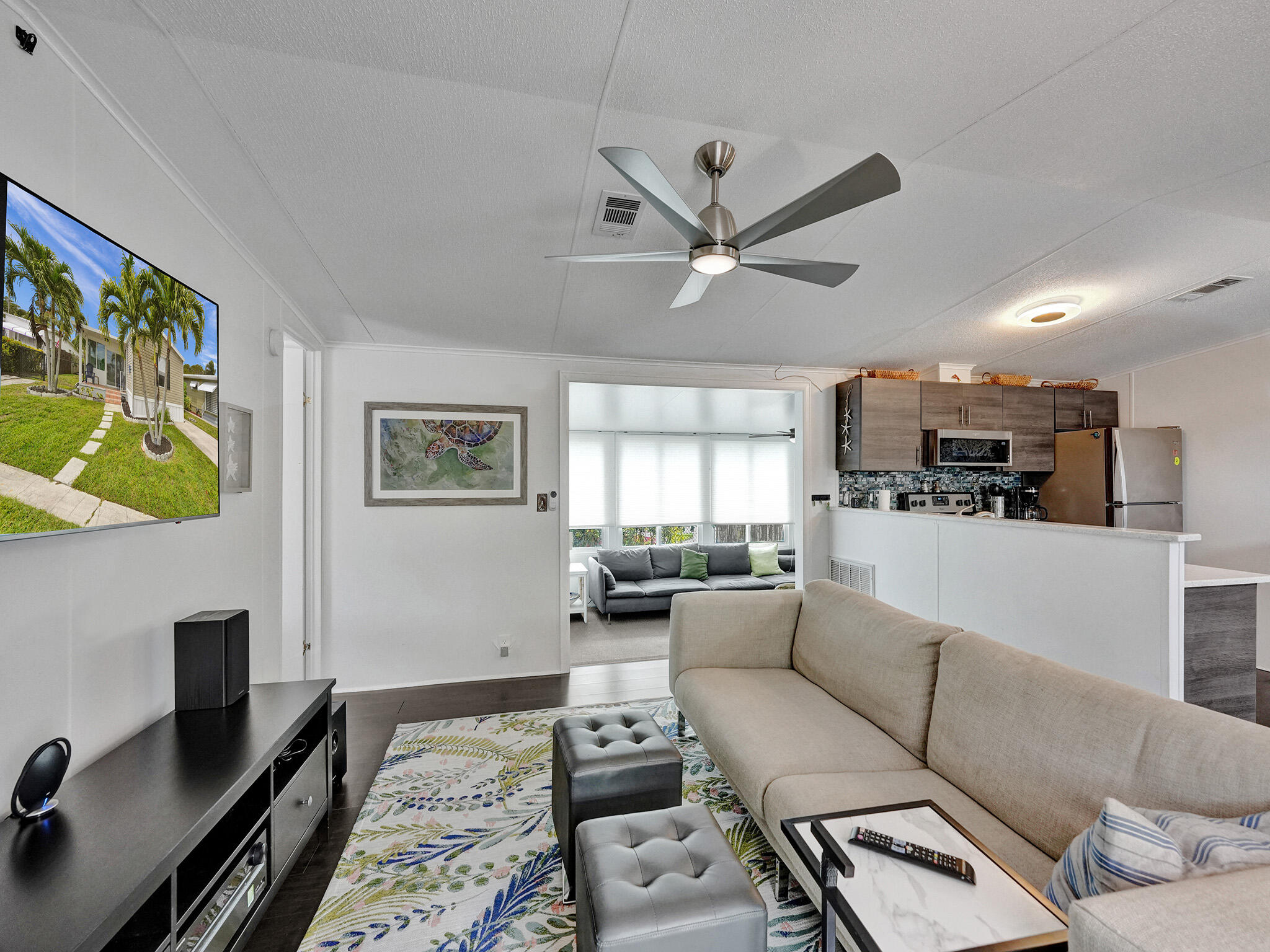 14609 Sunset Drive Delray Beach, FL 33445 - Photo 23 of 50 a living room with furniture and a fireplace