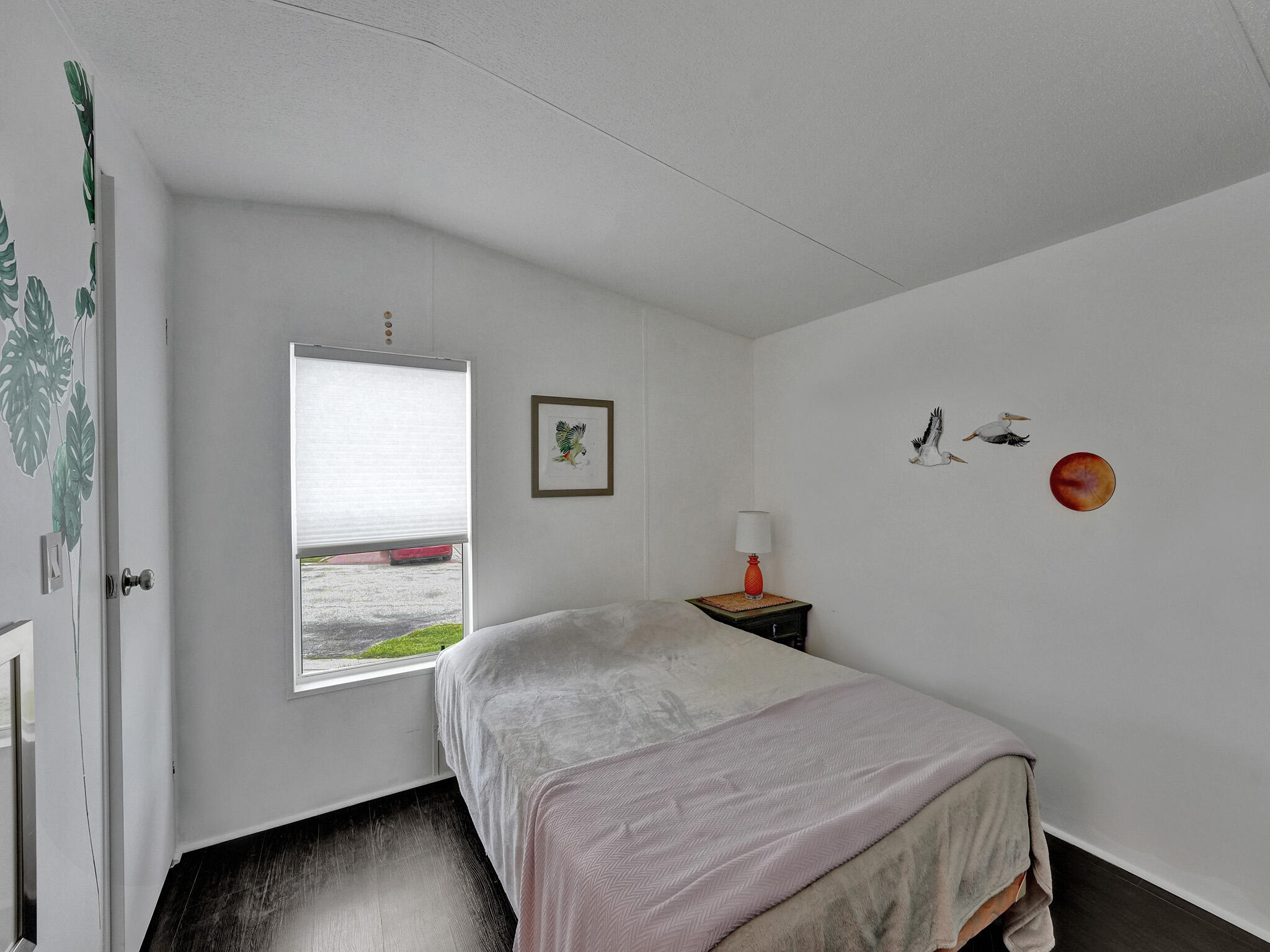 14609 Sunset Drive Delray Beach, FL 33445 - Photo 27 of 50 a bedroom with a bed and window