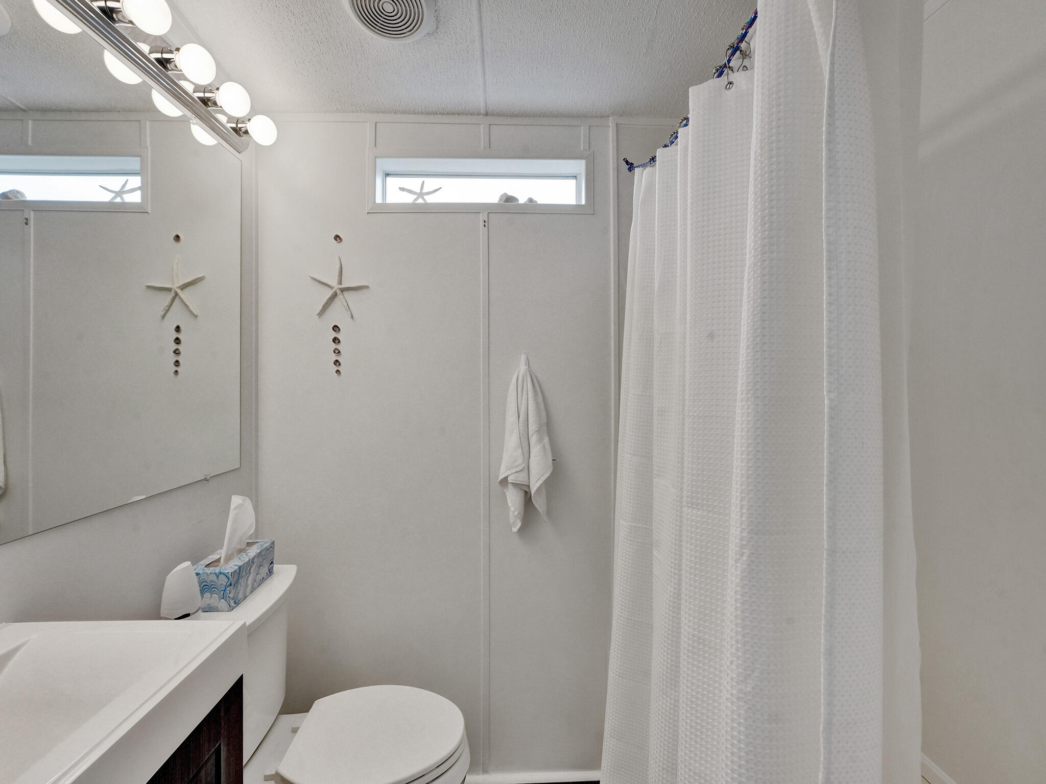 14609 Sunset Drive Delray Beach, FL 33445 - Photo 31 of 50 a bathroom with a toilet sink and shower