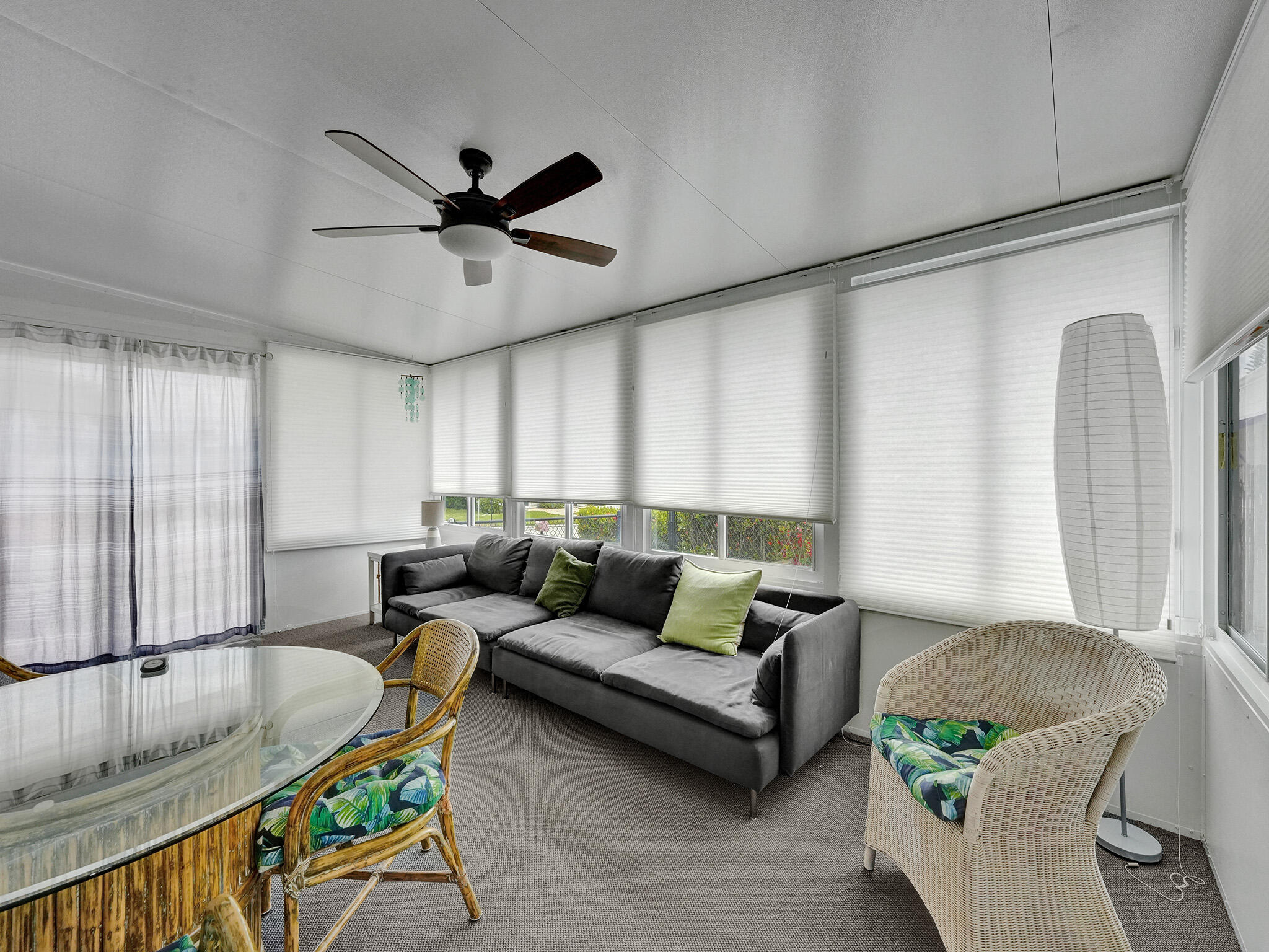 14609 Sunset Drive Delray Beach, FL 33445 - Photo 39 of 50 a living room with furniture and a window