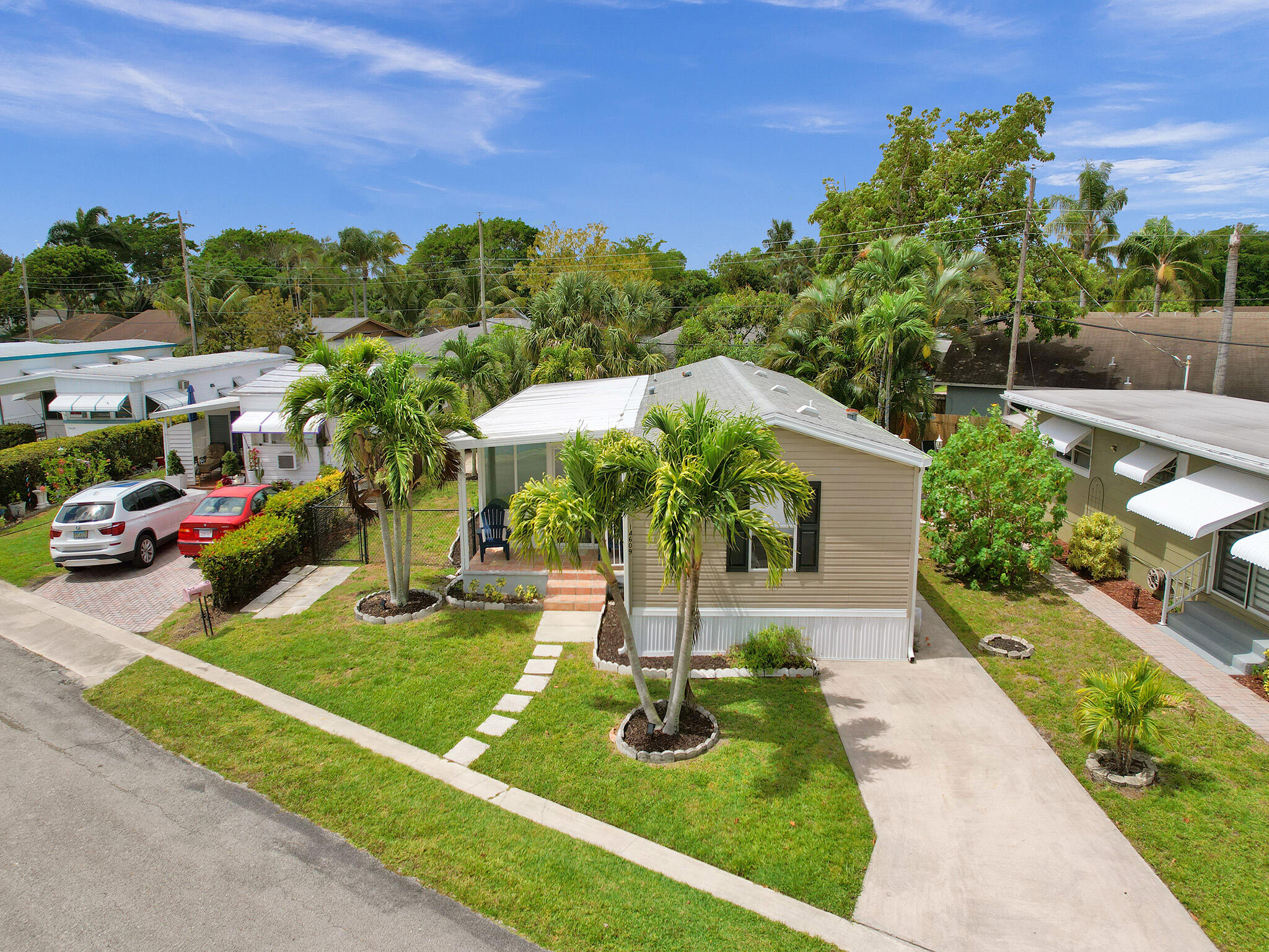 14609 Sunset Drive Delray Beach, FL 33445 - Photo 42 of 50 a front view of a house with a yard