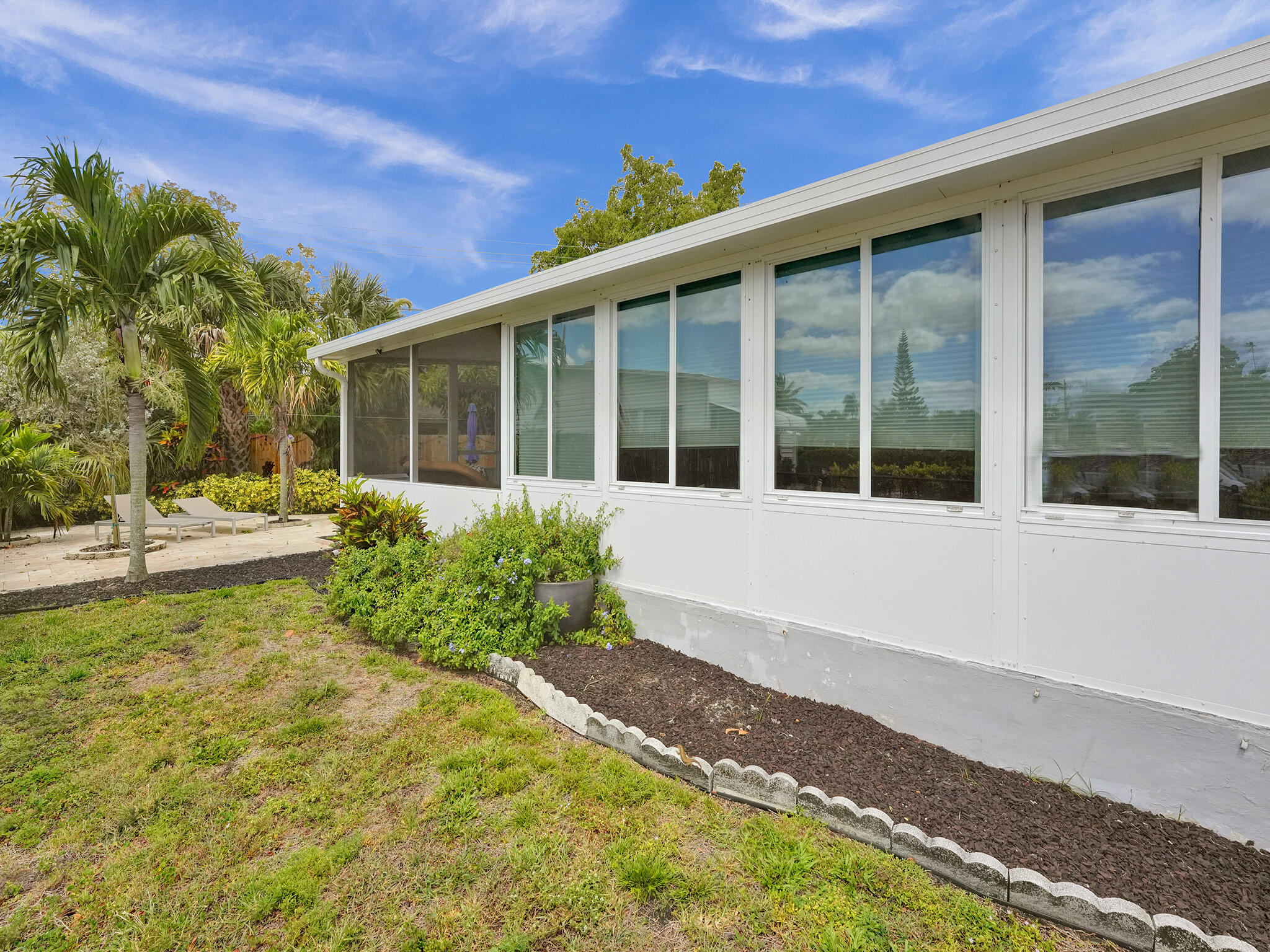 14609 Sunset Drive Delray Beach, FL 33445 - Photo 5 of 50 a view of a house with backyard and sitting area