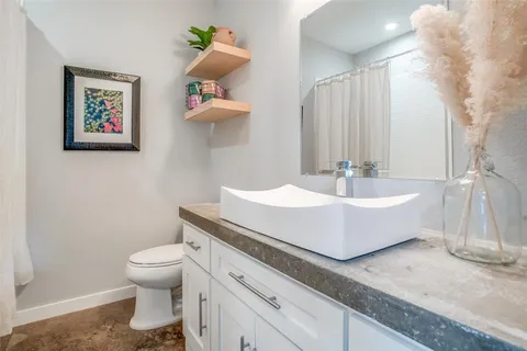 a bathroom with a sink a toilet and a bathtub