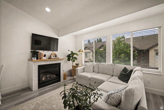 204 Lyman Lane Bountiful, UT 84010 - Photo 4 of 28 Living area featuring a gas fireplace with a mosaic tile surround and a wood mantel