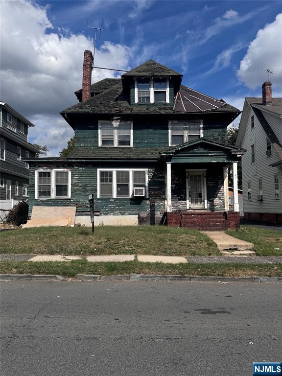 188 Rutledge Avenue East Orange, NJ 07017 - Photo 1 of 1 a front view of a house with a garden