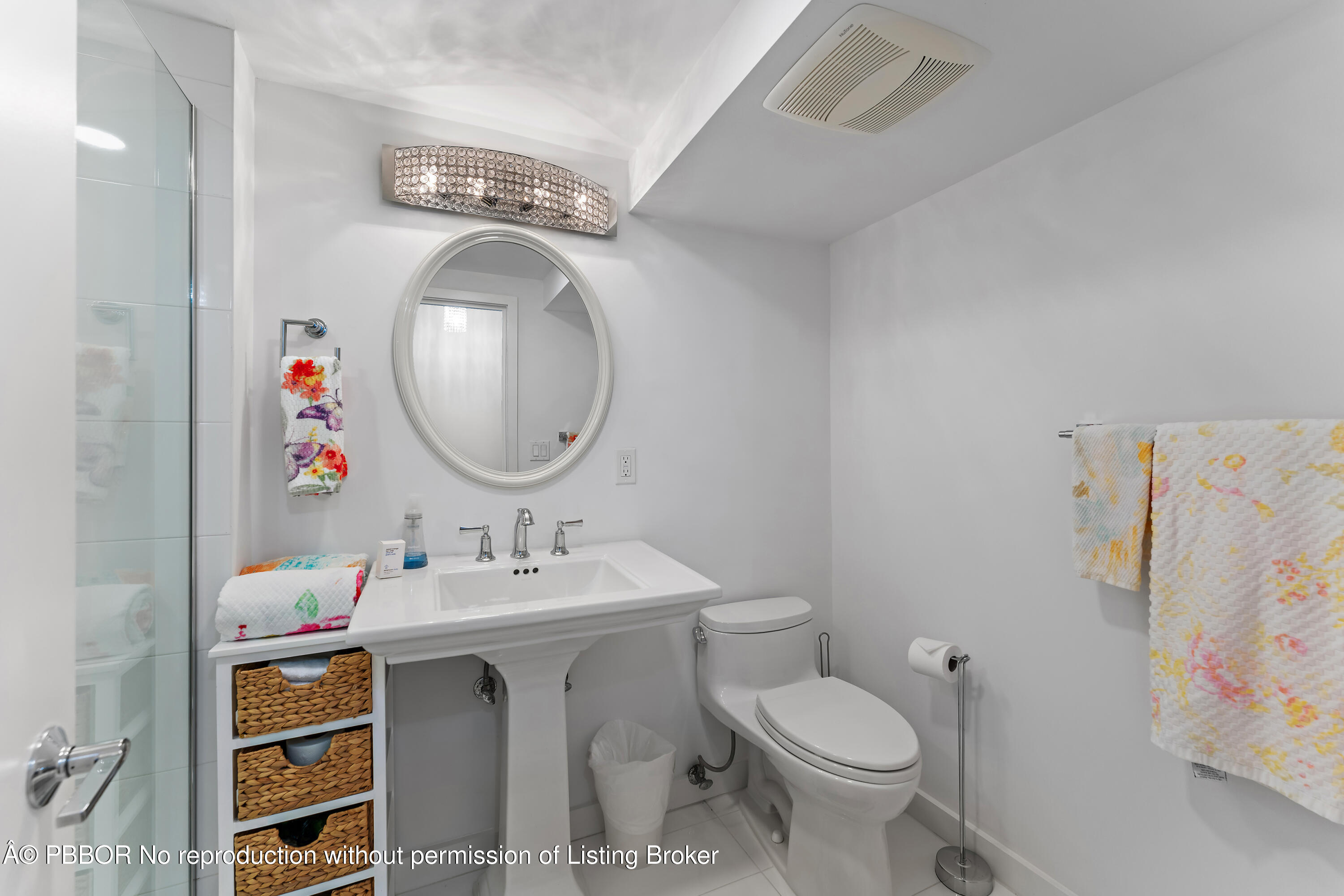 235 Sunrise Avenue, Unit 1107 & 1108 Palm Beach, FL 33480 - Photo 12 of 28 a bathroom with a toilet sink vanity and mirror