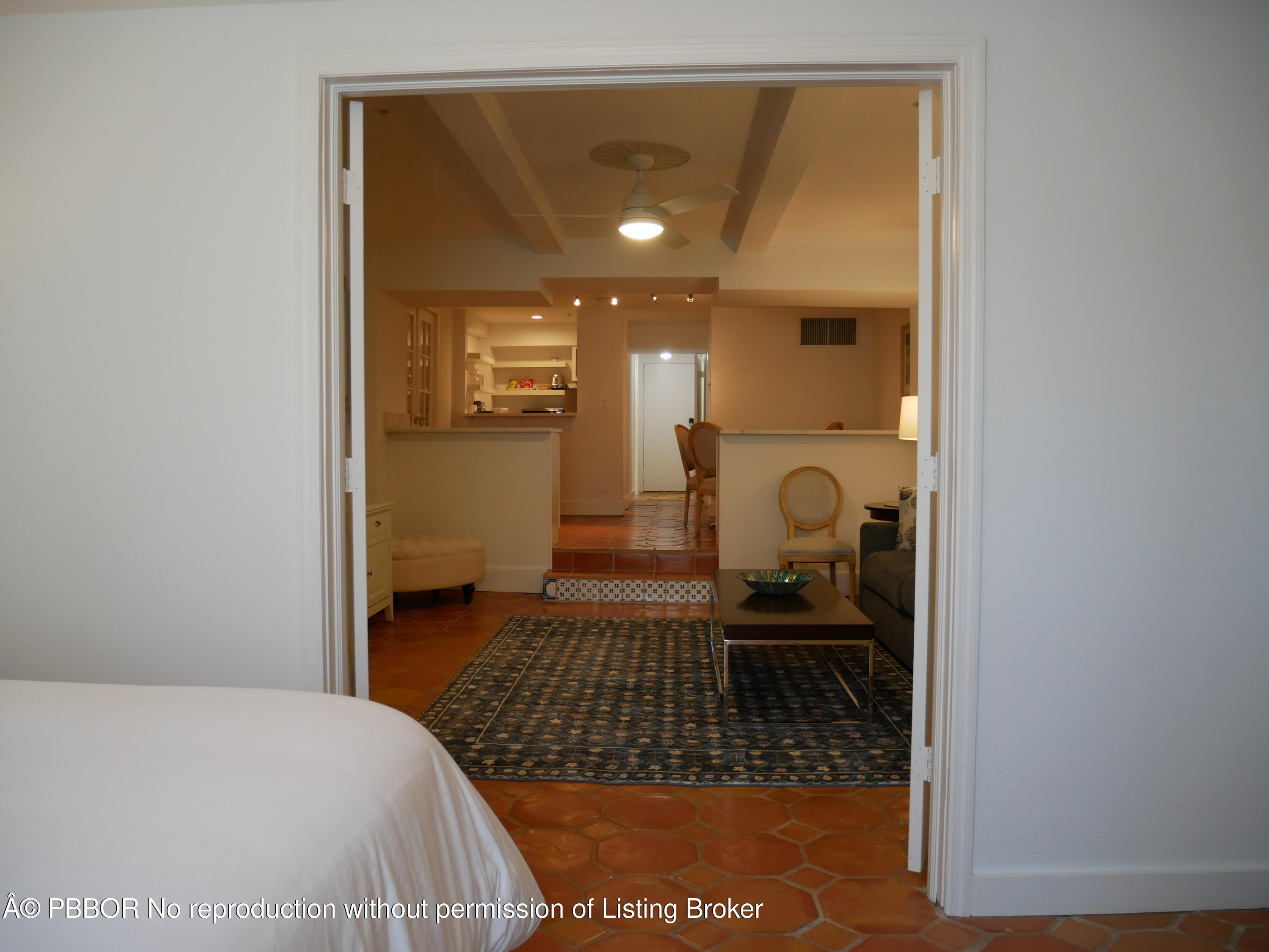 235 Sunrise Avenue, Unit 1107 & 1108 Palm Beach, FL 33480 - Photo 15 of 28 a bedroom with a bed and a table