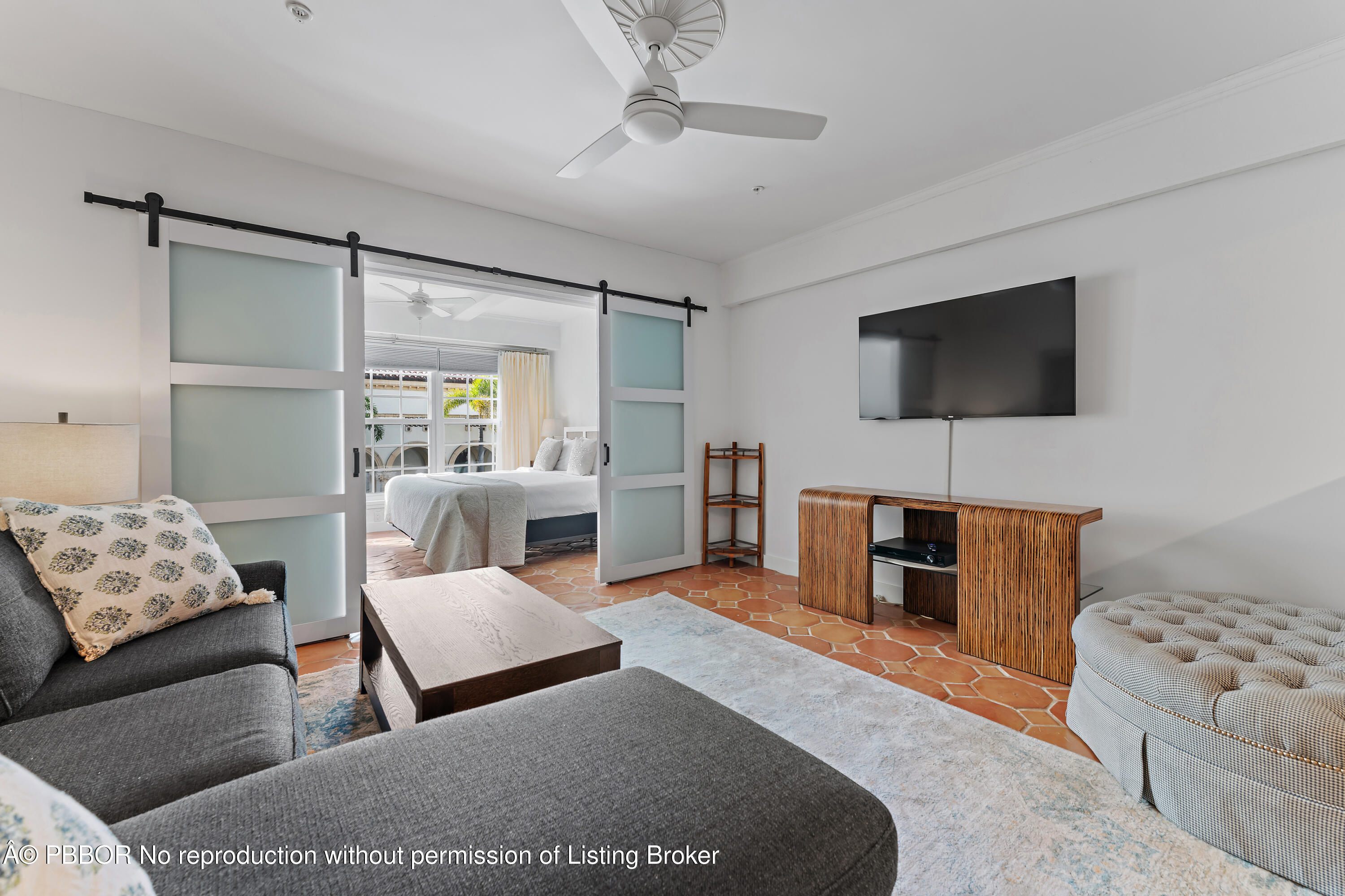 235 Sunrise Avenue, Unit 1107 & 1108 Palm Beach, FL 33480 - Photo 2 of 28 a living room with furniture and a flat screen tv