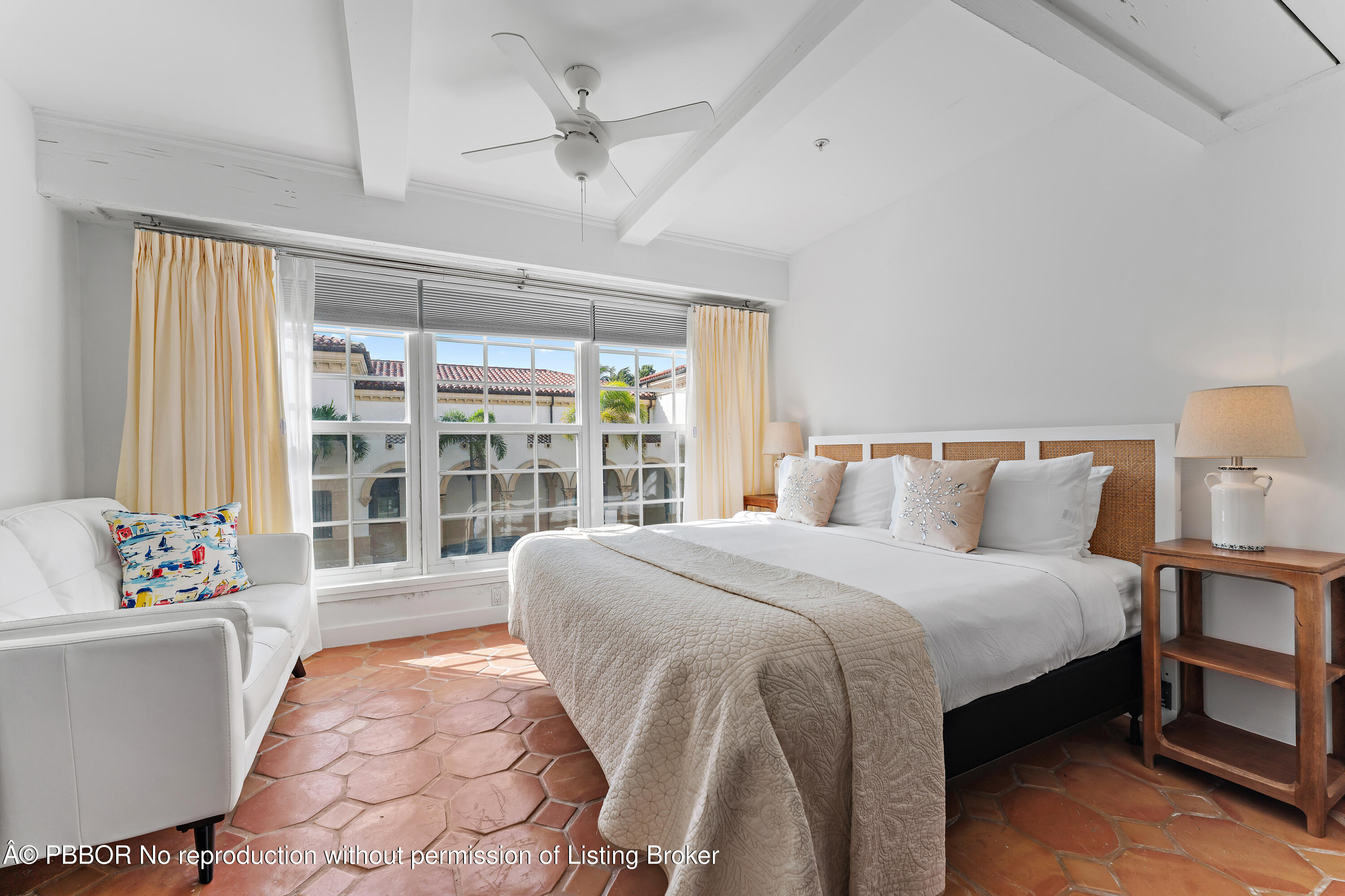 235 Sunrise Avenue, Unit 1107 & 1108 Palm Beach, FL 33480 - Photo 5 of 28 a spacious bedroom with a bed and a couch