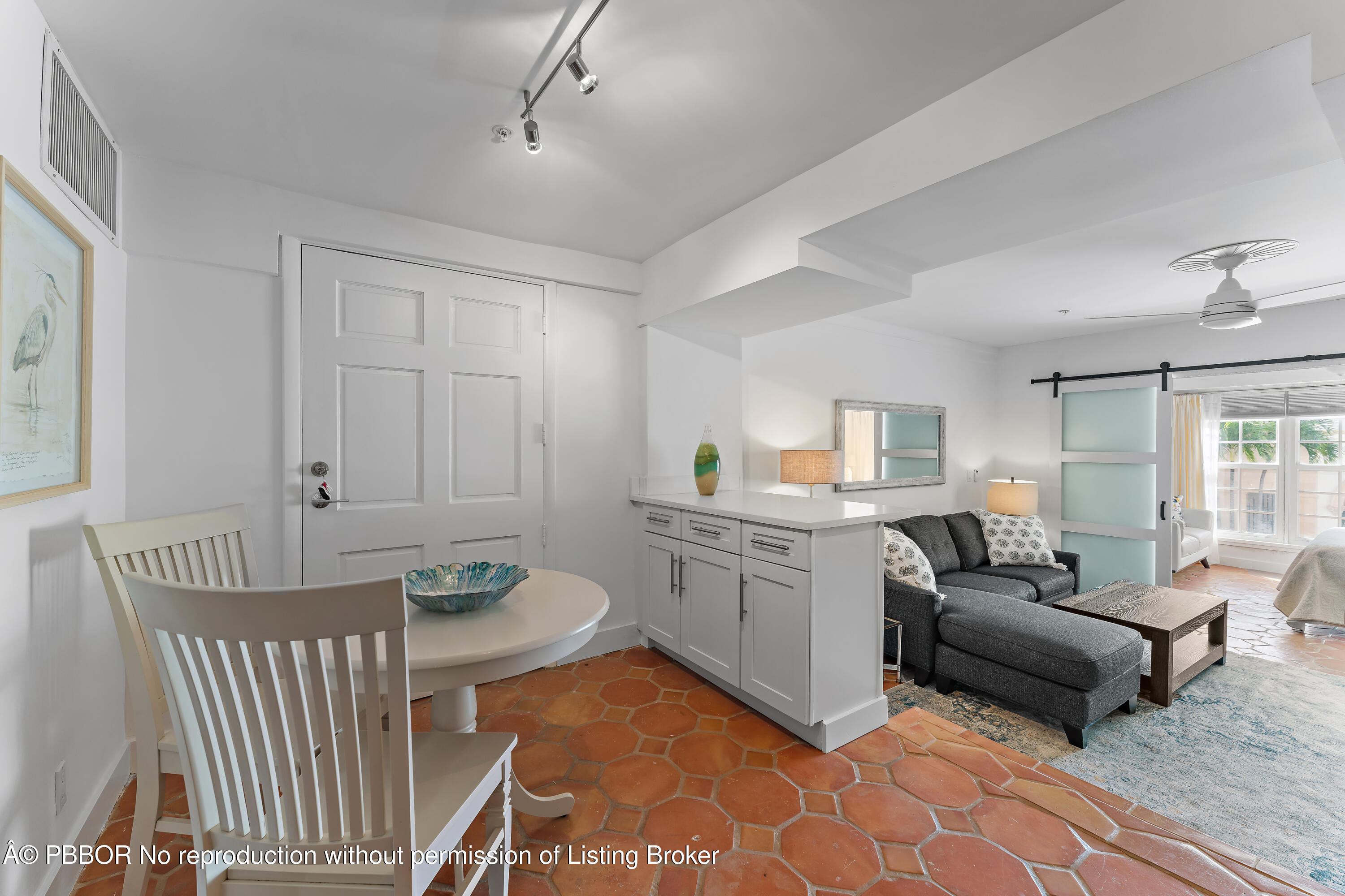 235 Sunrise Avenue, Unit 1107 & 1108 Palm Beach, FL 33480 - Photo 7 of 28 a living room with furniture and a table