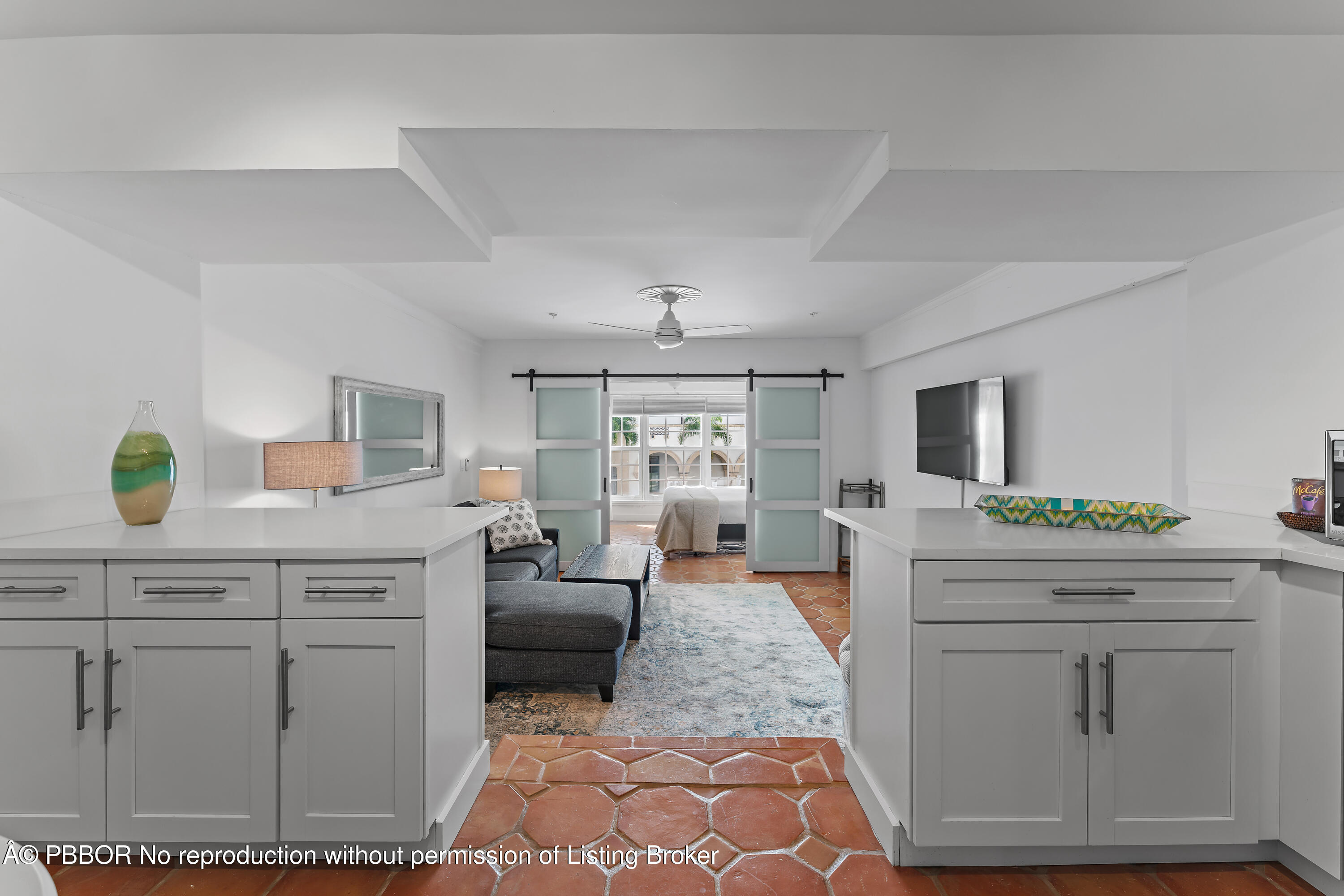 235 Sunrise Avenue, Unit 1107 & 1108 Palm Beach, FL 33480 - Photo 8 of 28 a living room with furniture and a chandelier