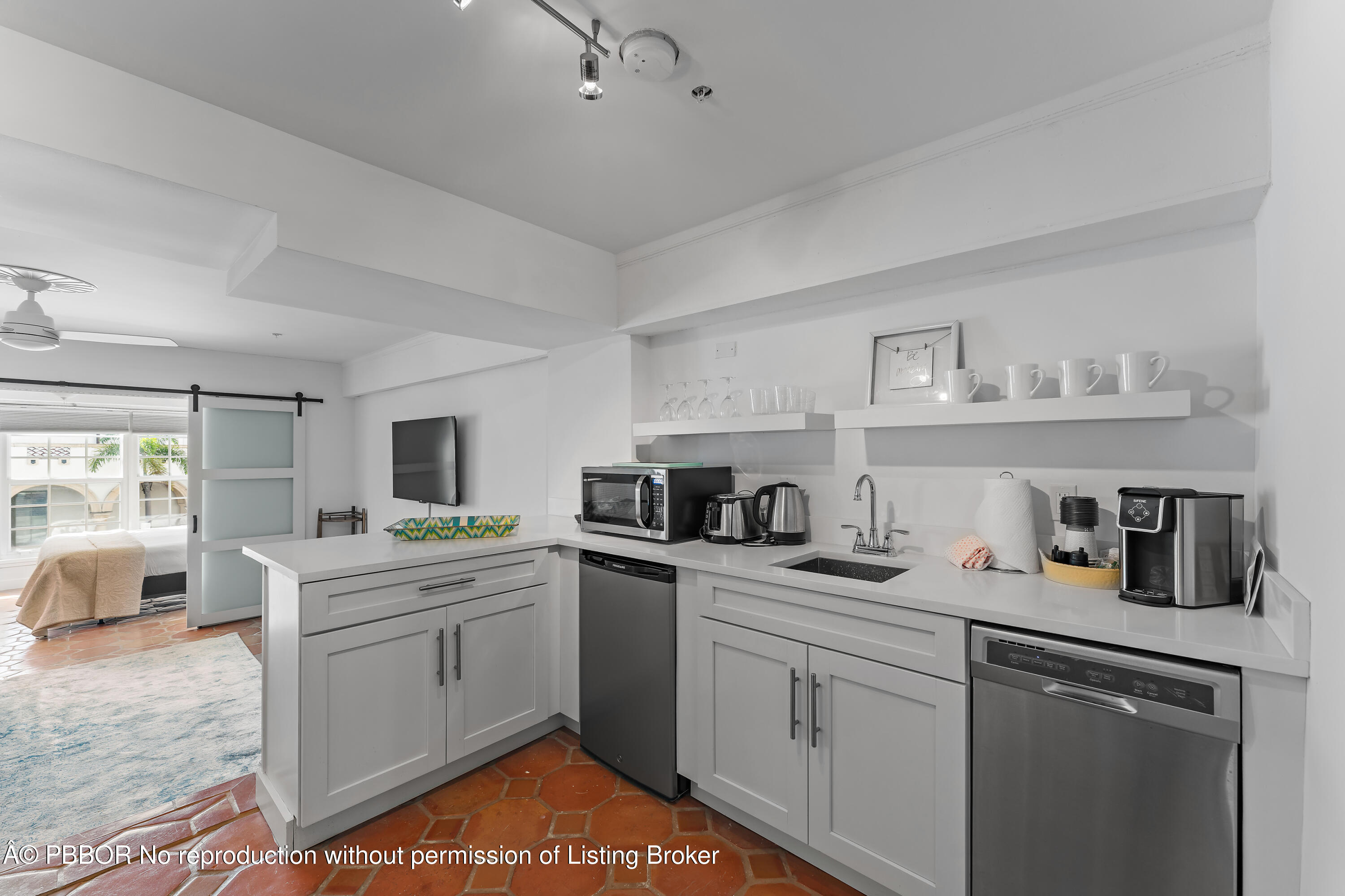 235 Sunrise Avenue, Unit 1107 & 1108 Palm Beach, FL 33480 - Photo 10 of 28 a kitchen with a sink stove and cabinets