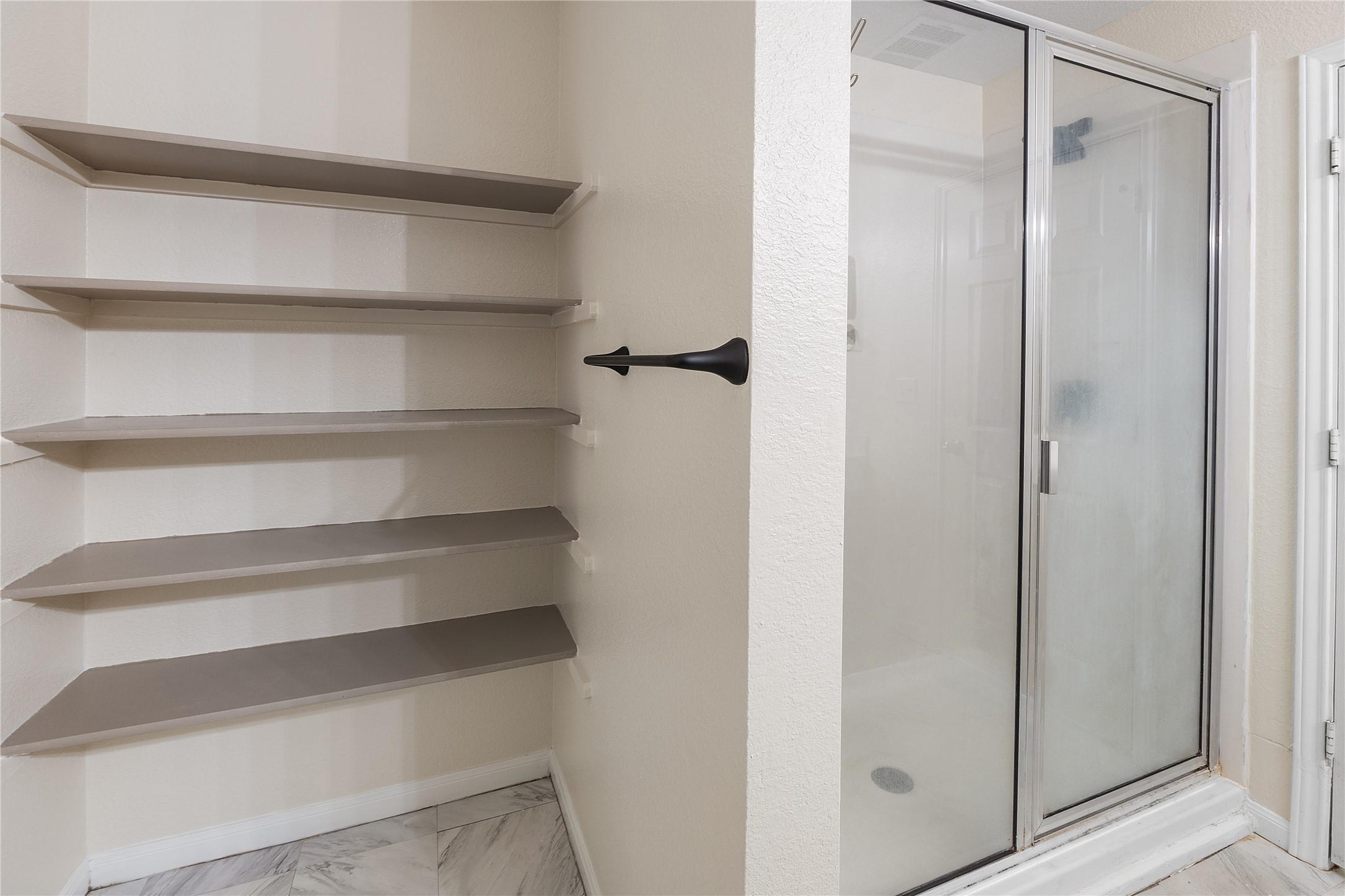 18436 Weatherby Lane Elgin, TX 78621 - Photo 20 of 23 Full bath with a stall shower and light marble finish flooring