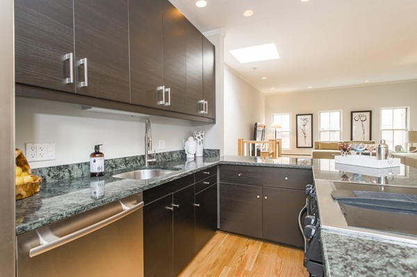 45 Lawrence Street, Unit 2 Boston, MA 02116 - Photo 4 of 10 a kitchen with granite countertop a sink a stove and cabinets
