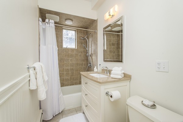 45 Lawrence Street, Unit 2 Boston, MA 02116 - Photo 9 of 10 a bathroom with a sink a toilet and shower