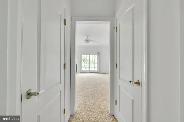 a view of a bathroom from a hallway