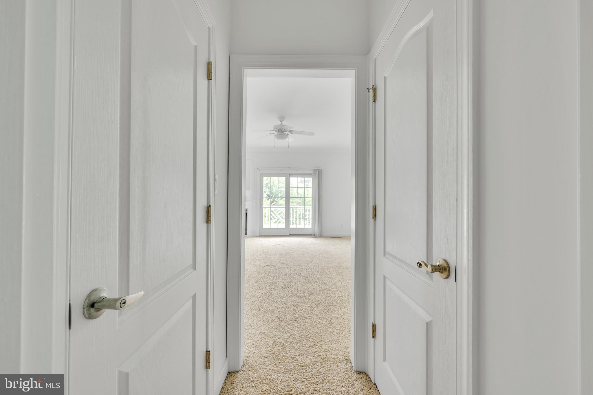 9823 Golf Course Road, Unit 16 Ocean City, MD 21842 - Photo 18 of 33 a view of a bathroom from a hallway