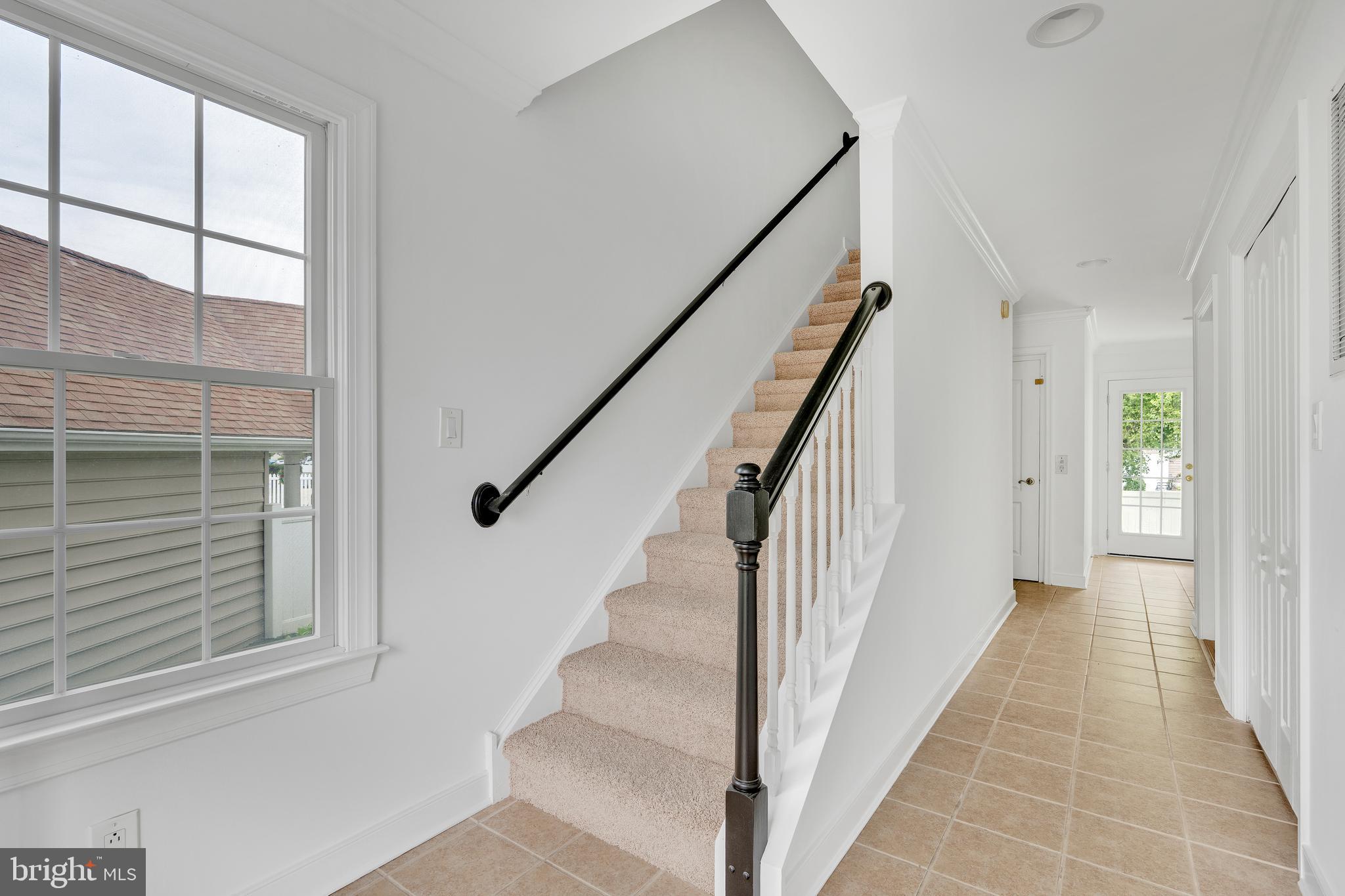 9823 Golf Course Road, Unit 16 Ocean City, MD 21842 - Photo 21 of 33 a view of staircase with white walls and windows