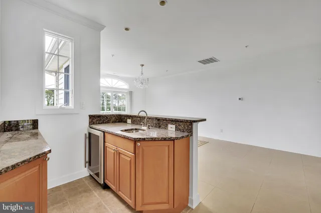 a kitchen with a stove and cabinets
