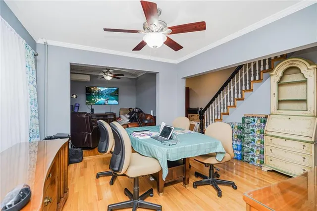 a kitchen with stainless steel appliances a stove a sink dishwasher and cabinets with wooden floor