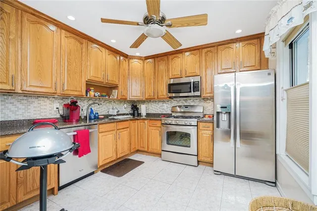 a en suite bathroom with a granite countertop sink and a mirror