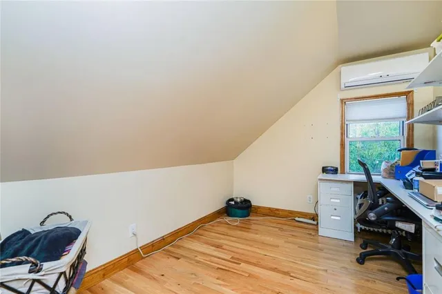 a view of room with furniture and wooden floor