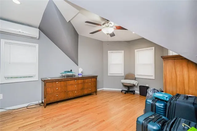 a bedroom with furniture and a chandelier