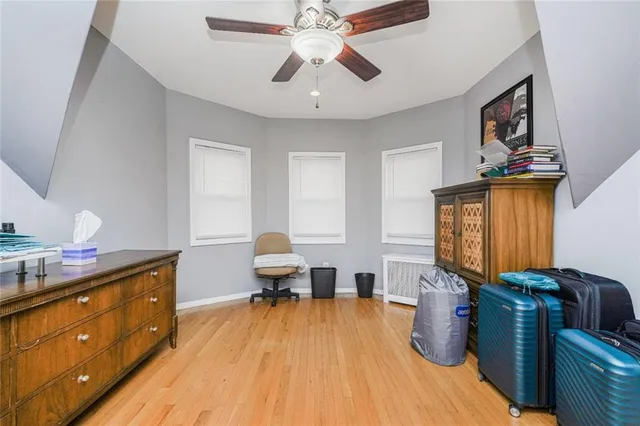 a view of a balcony with wooden fence