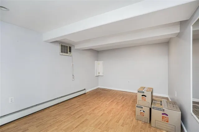 a bathroom with a toilet a sink and a mirror