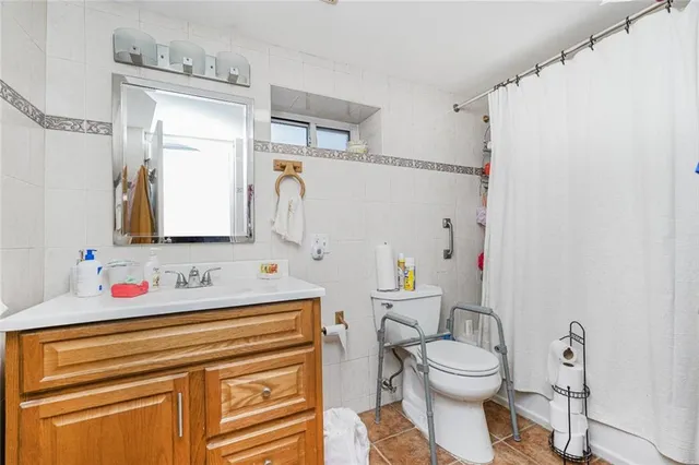 a kitchen with furniture and a flat screen tv