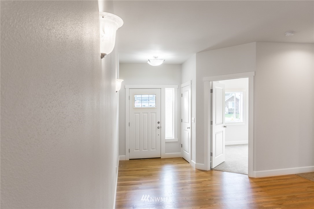 1803 Watkins Road Freeland, WA 98249 - Photo 12 of 25 a view of empty room with wooden floor
