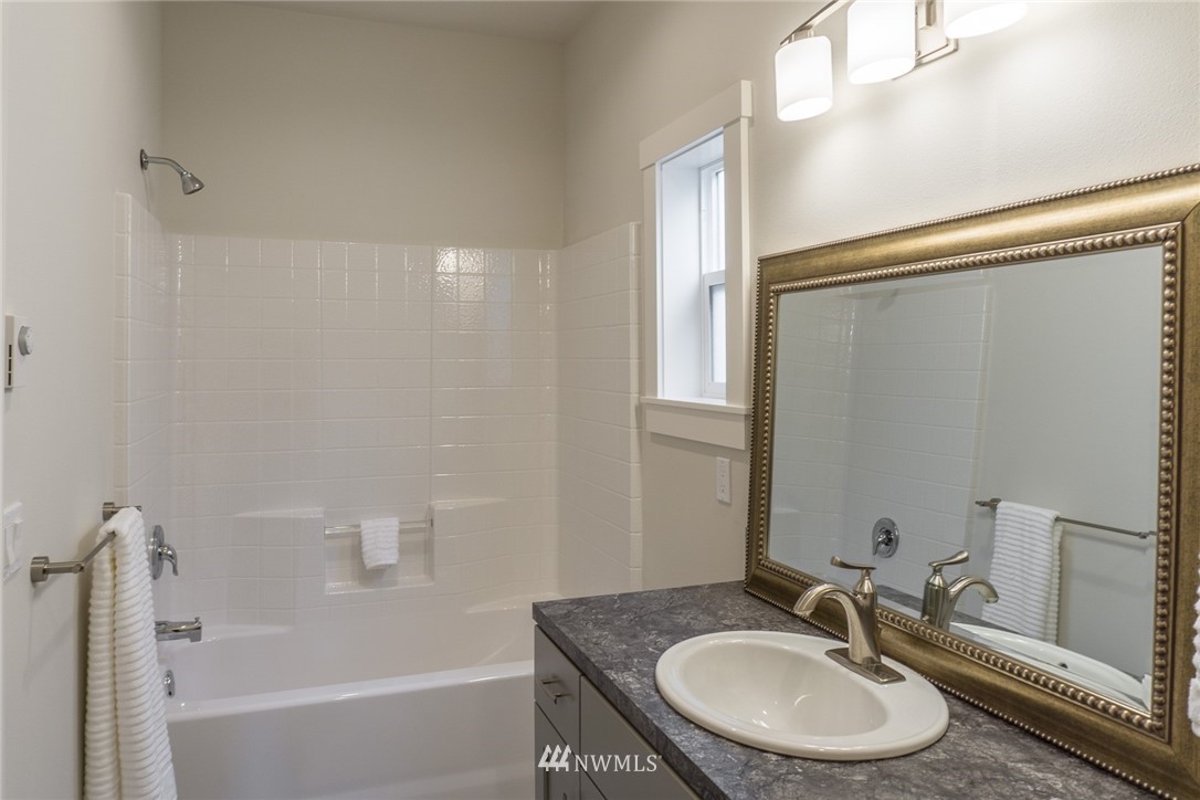1803 Watkins Road Freeland, WA 98249 - Photo 18 of 25 a bathroom with a sink and a mirror