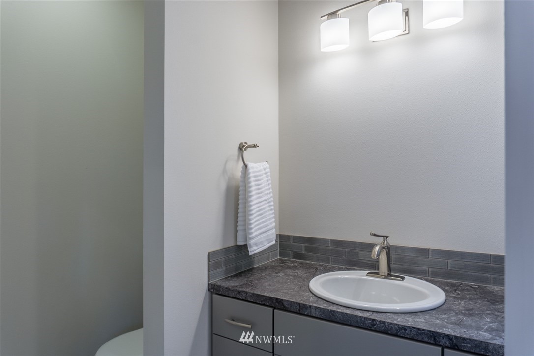 1803 Watkins Road Freeland, WA 98249 - Photo 21 of 25 a bathroom with a sink and a mirror