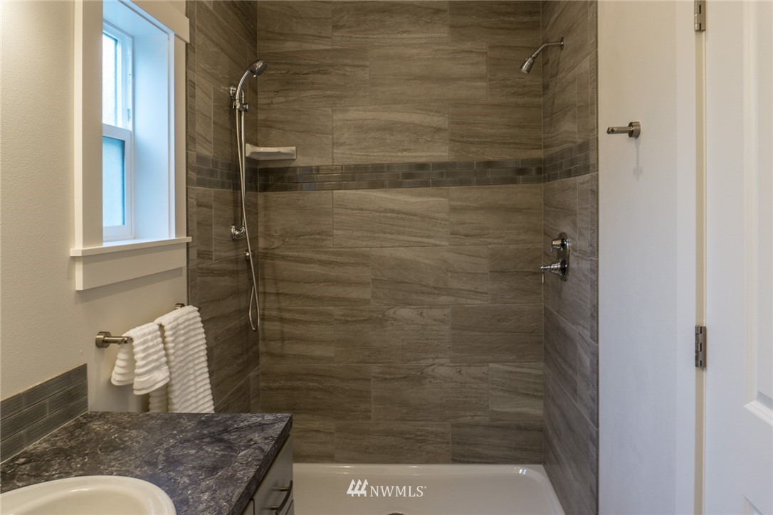 1803 Watkins Road Freeland, WA 98249 - Photo 22 of 25 a bathroom with a granite countertop shower