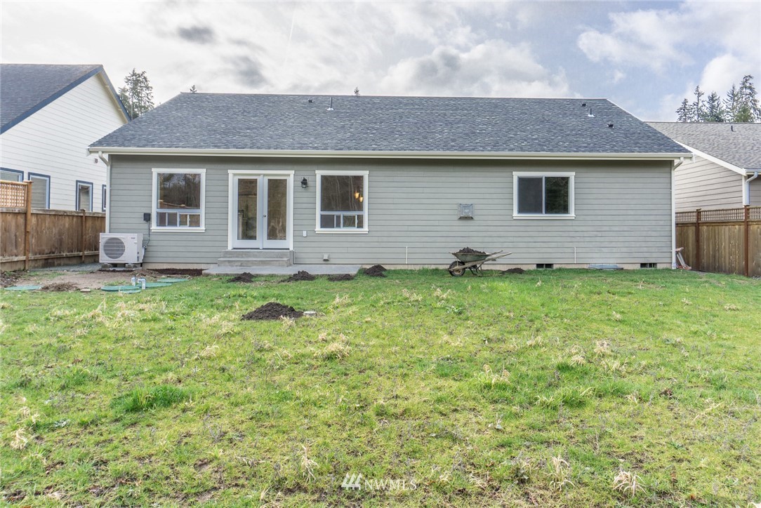 1803 Watkins Road Freeland, WA 98249 - Photo 23 of 25 a front view of a house with a garden and yard